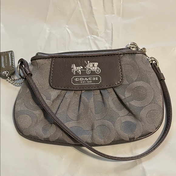 Coach Handbags - Coach carriage Signature Gray Wristlet w/silver hardware matching hangtag